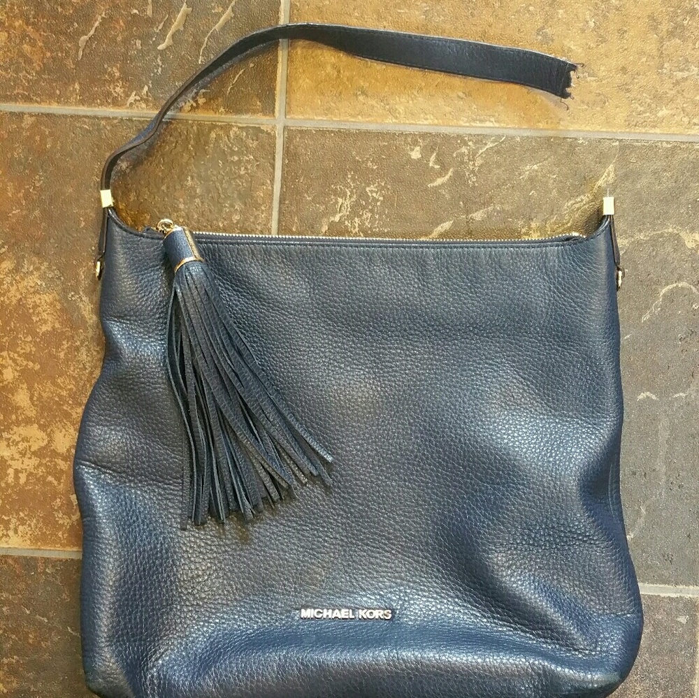 Michael kors blue leather purse. Broken strap